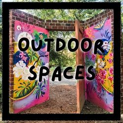 Photo of Painted brick doorway in Tyler Arboretum with "Outdoor Spaces" written across