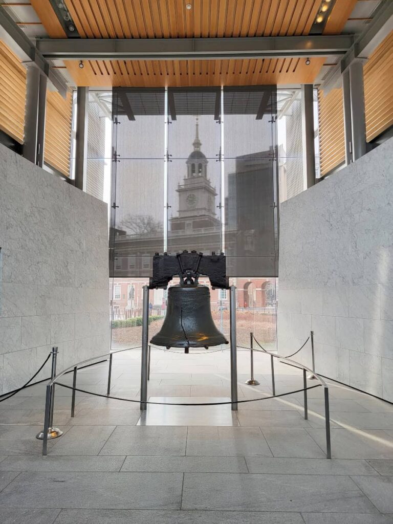 Looking at the Liberty Bell with Independence Hall seen through the window