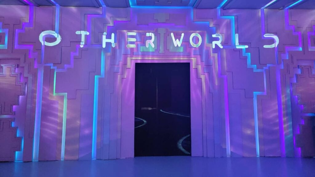 A purple sign reads Otherworld