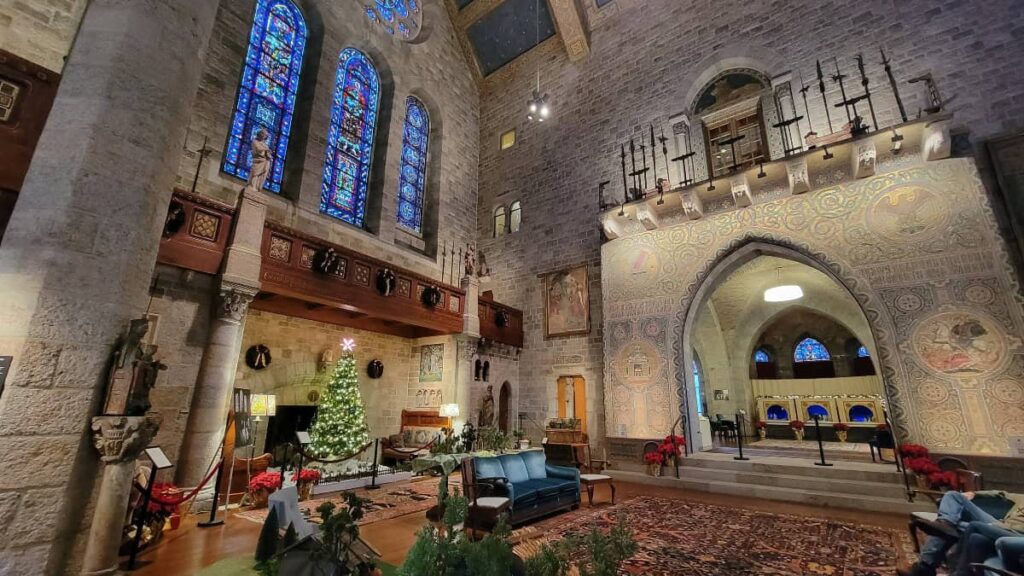 Inside the great hall at Glencairn looking at a gorgeous archway and christmas tree