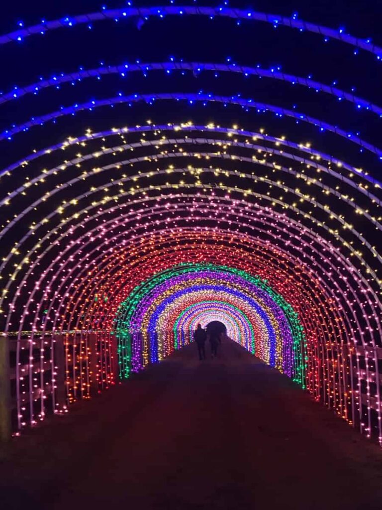 Standing inside a long light up tunnel