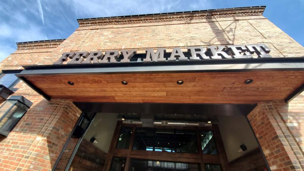 Looking up at the "Ferry Market" sign above the entrance
