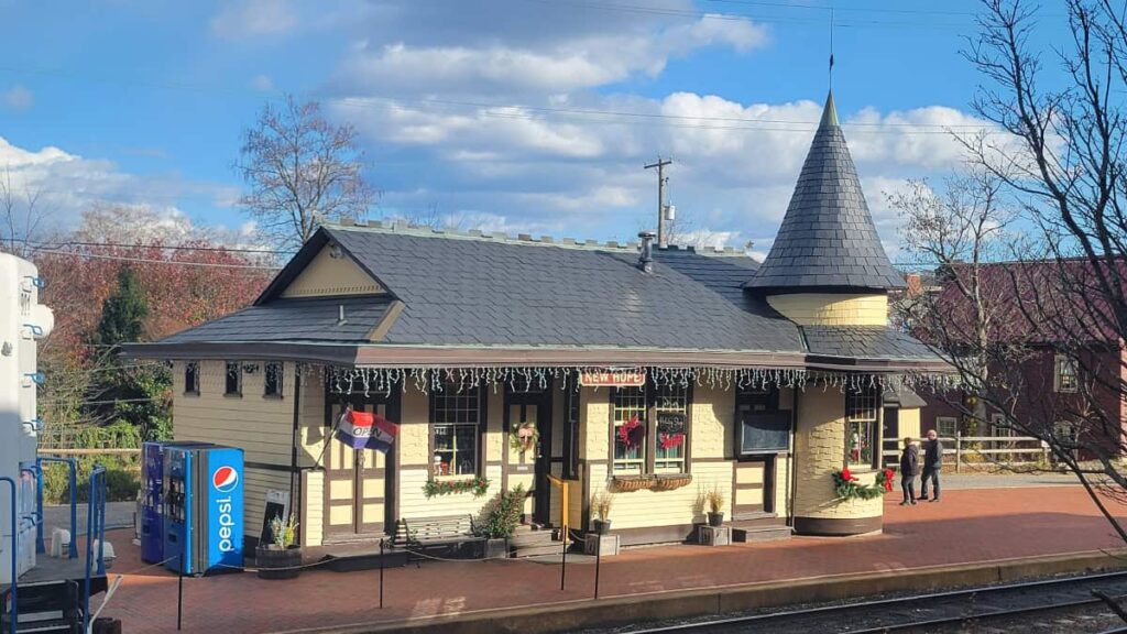 The New Hope Railroad original station is a cream colored building with a gray roof