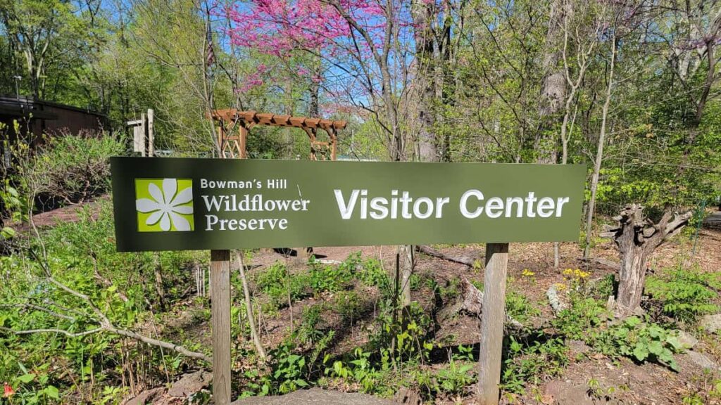 A large sign says "visitor center" at the bowmans hill wildflower preserve