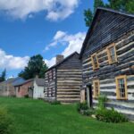 View of several log homes in a row at Bedford Village