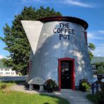 A building is shaped like a silver coffee pot