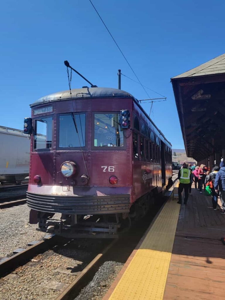 A century old trolley sits on tracks outside of the Electric Trolley Museum