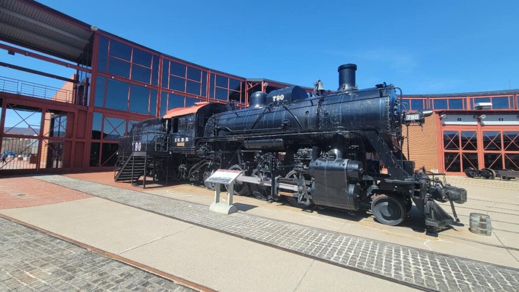 A black steam engine sits inside the Steamtown National Historic Site